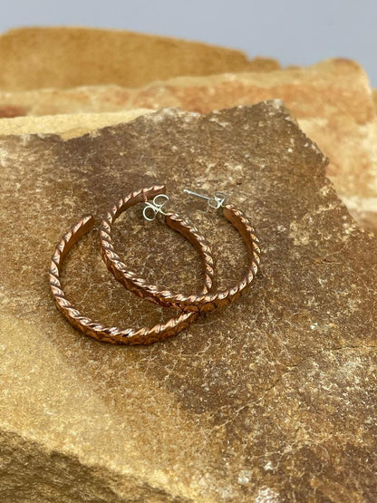 Copper Hoops with sterling silver posts by artist Elaine Tahe